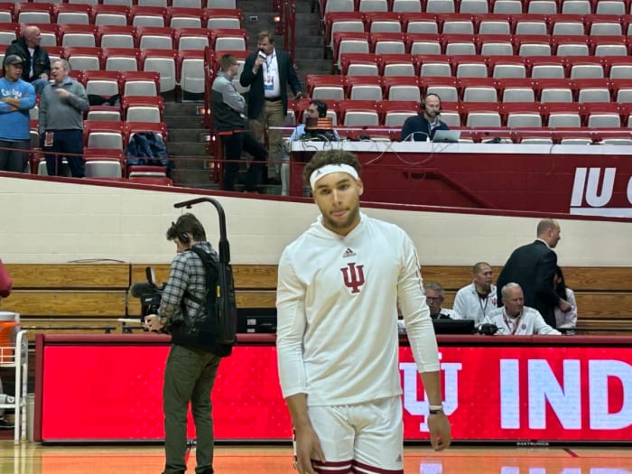 Race Thompson warms up donning his now famous headband ahead of the UNC game.
